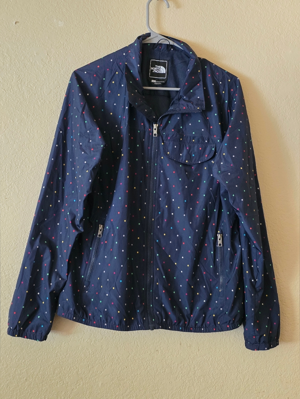 The North Face Women’s Navy Polka Dot Windbreaker Size L.
